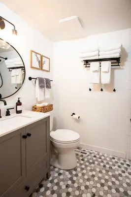 a bathroom with a toilet and a sink and a mirror at Golden Antler Escape - Minutes to the Beach in Incline Village