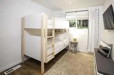 a bedroom with a bunk bed and a window at Golden Antler Escape - Minutes to the Beach in Incline Village