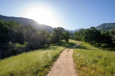 a dirt road in the middle of a field at Sequoia Retreat - Scenic Pool, Hot Tub, & Trails in Three Rivers