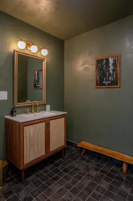 a bathroom with a sink and a mirror at Sequoia Retreat - Scenic Pool, Hot Tub, & Trails in Three Rivers