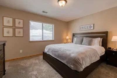 a bedroom with a large bed and a window at Pebble Place at Tahoe Donner by Tahoe Getaways - Pet Friendly, Single Level w HOA in Truckee