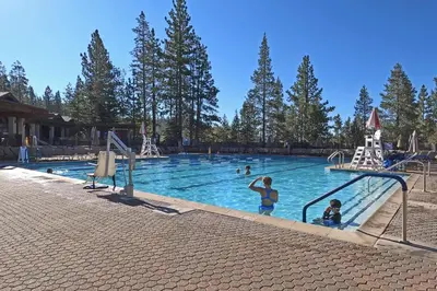 a group of people in a swimming pool at Pebble Place at Tahoe Donner by Tahoe Getaways - Pet Friendly, Single Level w HOA in Truckee