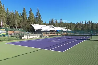 a tennis court with a tennis racket on it at Pebble Place at Tahoe Donner by Tahoe Getaways - Pet Friendly, Single Level w HOA in Truckee