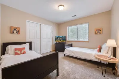 a bedroom with two beds and a window at Pebble Place at Tahoe Donner by Tahoe Getaways - Pet Friendly, Single Level w HOA in Truckee