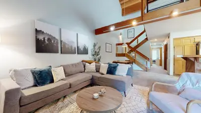 a living room with a couch and a table at Snowcreek IV #594 condo in Mammoth Lakes