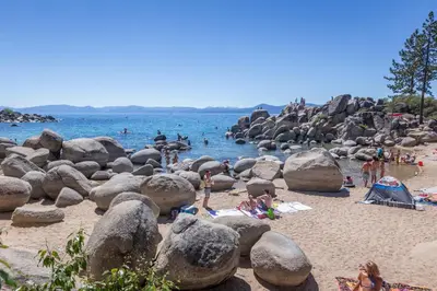 a group of people on a beach with rocks at Mountain Retreat - Lake Tahoe - Incline Village - Private Garage in Incline Village