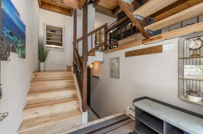 a staircase in a house with wooden floors at Mountain Escape - Lake Tahoe - Incline Village - Private Garage in Incline Village