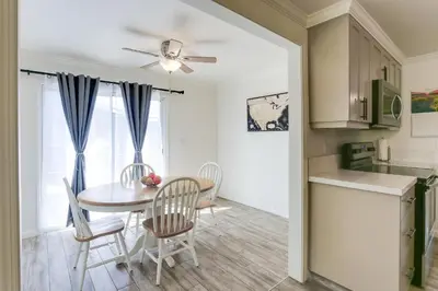 a kitchen and dining room with a table and chairs at Mtn-View Home with Patio and Grill in Woodlake in Woodlake