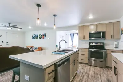 a kitchen with a sink and a stove top oven at Mtn-View Home with Patio and Grill in Woodlake in Woodlake