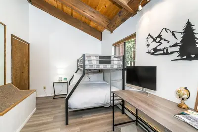 a bedroom with a bunk bed and a desk at Mountain Getaway - Lake Tahoe - Incline Village - Private Garage in Incline Village