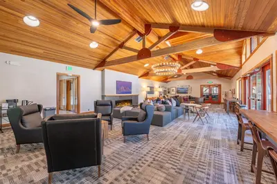 a lobby with couches and chairs and a fireplace at Luxury Home Walk to Ski Lifts 6 Pools Food Private Hot-Tub Yard Fun Bunk Room in Truckee