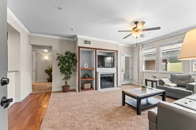 a living room with a couch and a fireplace at NEW Chic 2BR Stay with Heated Pool Gym & Mini Golf in Steamboat