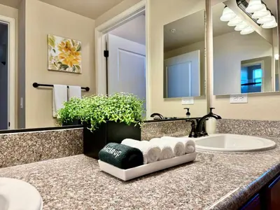 a bathroom counter with a sink and a mirror at NEW Chic 2BR Stay with Heated Pool Gym & Mini Golf in Steamboat