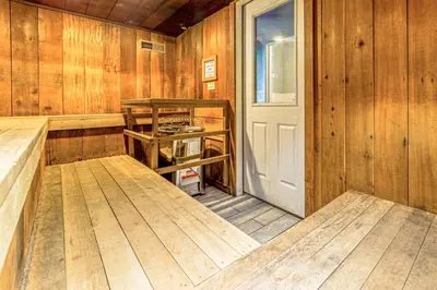 a room with wood paneled walls and a door at Walk to Shops and Eats Mammoth Lakes Condo with Pool in Mammoth Lakes
