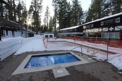 a swimming pool in the snow next to a building at HCC0612 - Sitzmark Ski Condo townhouse in South Lake Tahoe