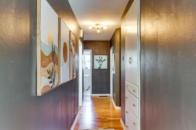 a hallway of a home with wooden floors and walls at 24 Mi to Slopes! Family Reno Home with Outdoor Oasis in Reno