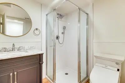 a bathroom with a shower and a toilet and a sink at 24 Mi to Slopes! Family Reno Home with Outdoor Oasis in Reno