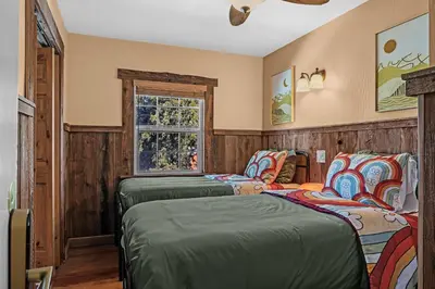 a bedroom with two beds and a window at The Extraordinary Camino Hotel in Camino