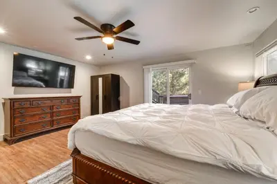 a bedroom with a bed and a ceiling fan at Near Downhill Ski Resort! Hot Tub Haven in Truckee in Truckee