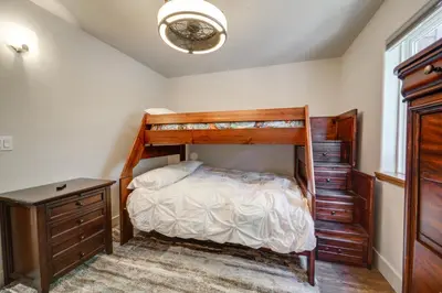 a bedroom with a bunk bed and a dresser at Near Downhill Ski Resort! Hot Tub Haven in Truckee in Truckee