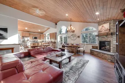 a living room with a couch and a table at Near Downhill Ski Resort! Hot Tub Haven in Truckee in Truckee