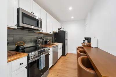 a kitchen with white cabinets and a stove top oven at Experience Zephyr Cove Retreat Relax Enjoy #6 in Zephyr Cove