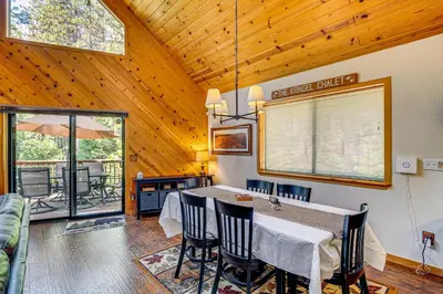 a dining room with a table and some chairs at Game Room Blue Lake Mountain Retreat in Arnold in Arnold
