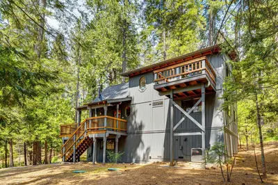 a house in the woods with a balcony at Game Room Blue Lake Mountain Retreat in Arnold in Arnold