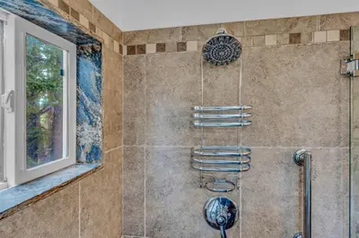 a bathroom with a shower with a shower head at Spacious Pet-Friendly Truckee Retreat with Hot Tub in Truckee