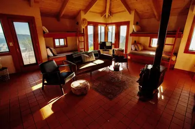 a living room with a couch and chairs and a bed at Priest Ranch with Guest House and Pool in Big Oak Flat