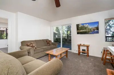 a living room with two couches and a table at Yosemite Aviary and Quail Within Yosemite - 2 Separate Family Units Welcoming Up To 14 Guests in Yosemite West