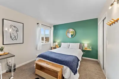 a bedroom with a bed and a green wall at HNC0617 - Stagecoach Summit Retreat condo in Stateline