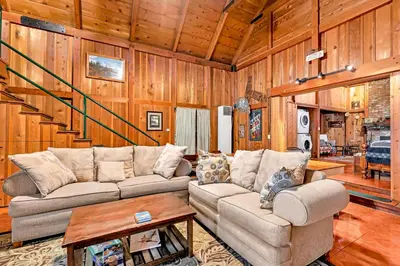a living room with a couch and a table at Rustic Knotty Pine - Old Cabin Vibes in Shaver Lake
