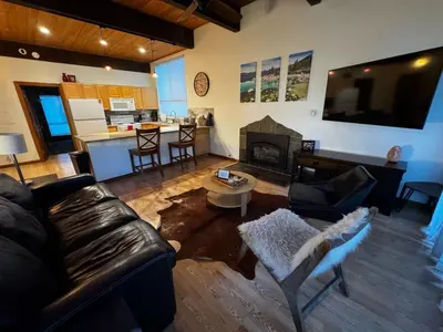 a living room with a couch and a fireplace at Spacious Condo walking distance to Hyatt and Beaches in Incline Village