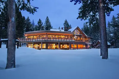 a large house in the snow at night at Paradise on Pinnacle in Truckee