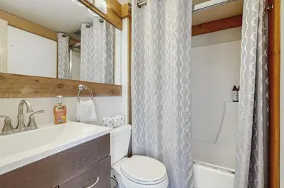 a bathroom with a sink and a toilet and a shower at Silver Strike Summit in Truckee