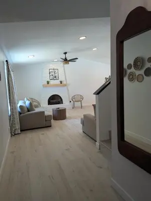 a living room with a couch and a fireplace at Welcome to Lilith's House! in Clovis