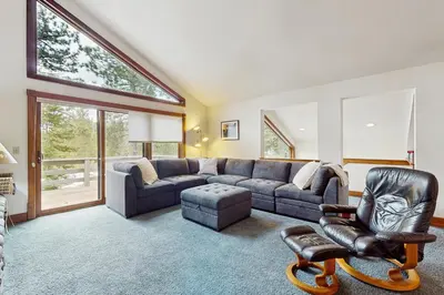 a living room with a couch and a chair at Peace and Pines at Upper Ward Creek in Tahoe City