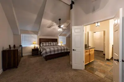 a bedroom with a bed and a ceiling fan at Charming and Relaxing Getaway with Great Views in Shaver Lake