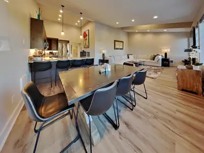 a kitchen and living room with a large wooden table and chairs at 1849 Condos 642 home in Mammoth Lakes
