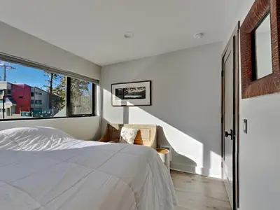 a bedroom with a bed and a large window at 1849 Condos 642 home in Mammoth Lakes