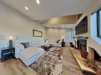 a living room with a couch and a fireplace at 1849 Condos 642 home in Mammoth Lakes