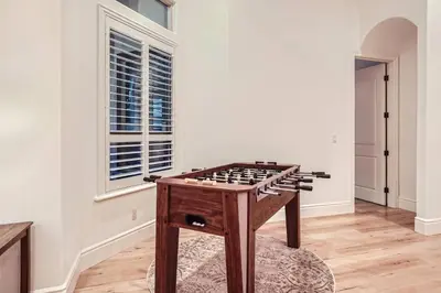 a chess table in a room with a window at Beautiful Granite Bay Home near Folsom Lake in Granite Bay
