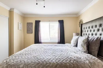 a bedroom with a large bed and a window at Memorable Moment at Placid Blue with Pool & Hot Tub in Sacramento