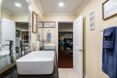 a bathroom with a white tub and a sink at Memorable Moment at Placid Blue with Pool & Hot Tub in Sacramento