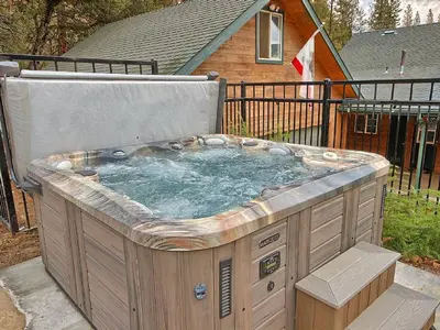 a hot tub in the backyard of a house at Gorgeous Vacation Rental with Hot Tub near Yosemite National Park, California in Mariposa