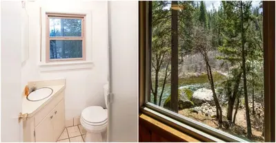 a bathroom with a toilet and a window with a view at Cozy Riverside Cabin Rental with Easy Access to Chilnualna Falls in California in Wawona