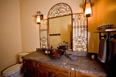 a bathroom with a sink and a mirror at Exquisite Cottage Rental on Peaceful Vineyard near Bear Valley, California in Angels Camp
