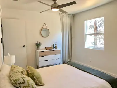 a bedroom with a bed with a ceiling fan at Magical property in the Alabama Hills - HOT TUB in Lone Pine