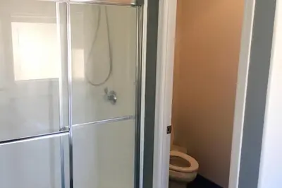 a bathroom with a shower and a toilet at 3 B 2 BA home in a Serene, quiet cul de sac in Lone Pine